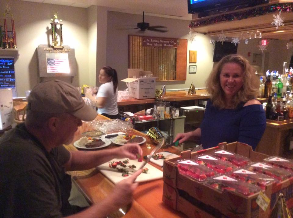 ER Carol & Rick Barth cutting strawberrys' for the champagne glasses on New Years Eve